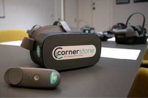 A Cornerstone VR headset and controller on a table