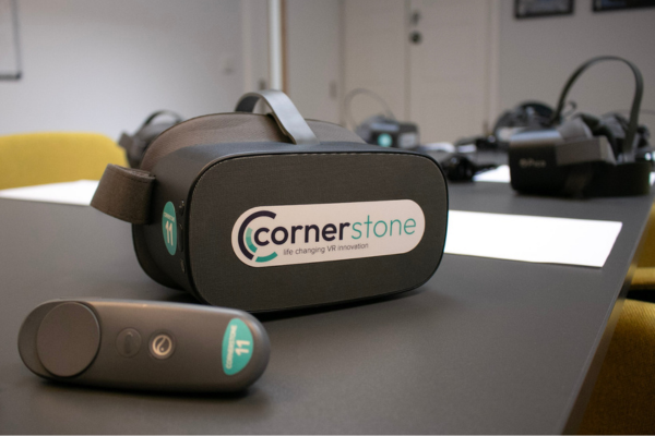 A Cornerstone VR headset and controller on a table